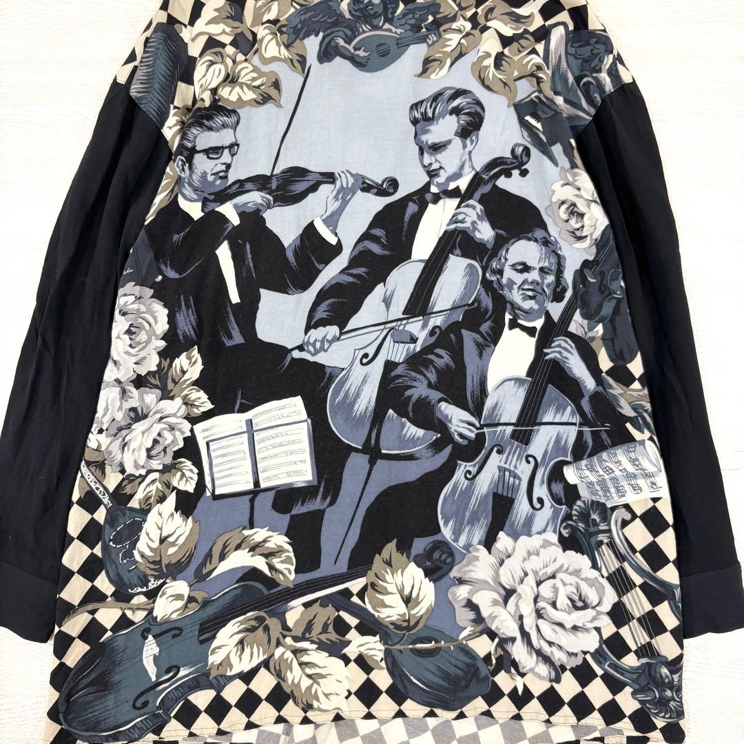 トクコプルミエヴォル✨デザインチュニック　ブラウス　総柄　音楽家　変形　9号