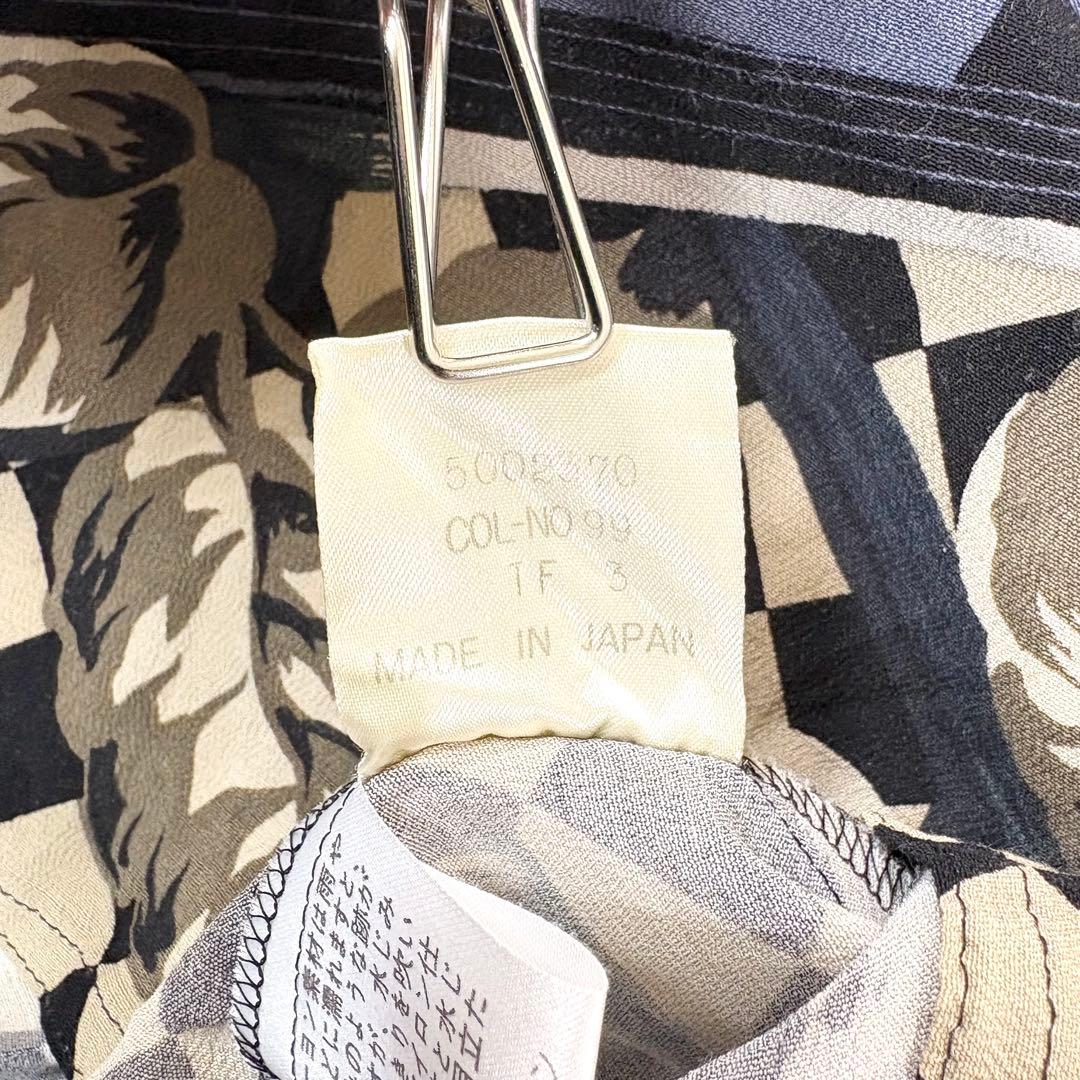 トクコプルミエヴォル✨デザインチュニック　ブラウス　総柄　音楽家　変形　9号