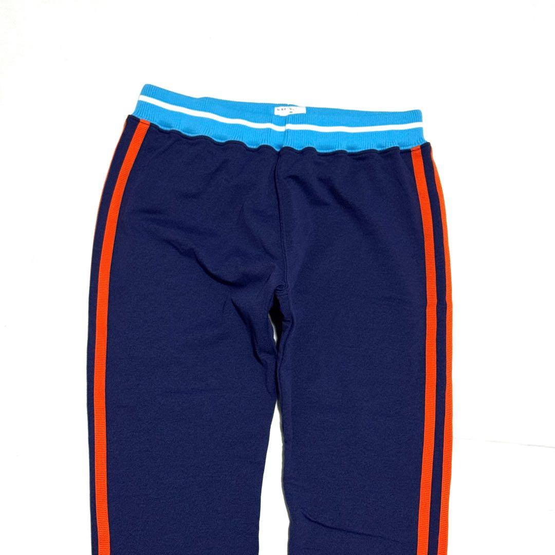 目立つロゴ良好　マークアンドロナ　レディースレギンス　紺橙ライン日本製