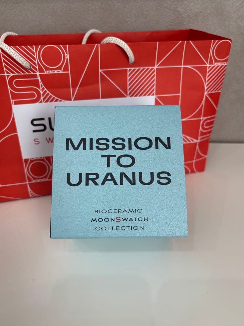 スウォッチ　オメガ　ウラヌス　水色