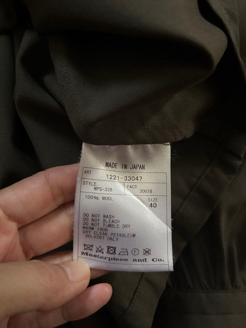 サイscyeのウールギャザーブラウスカーキ