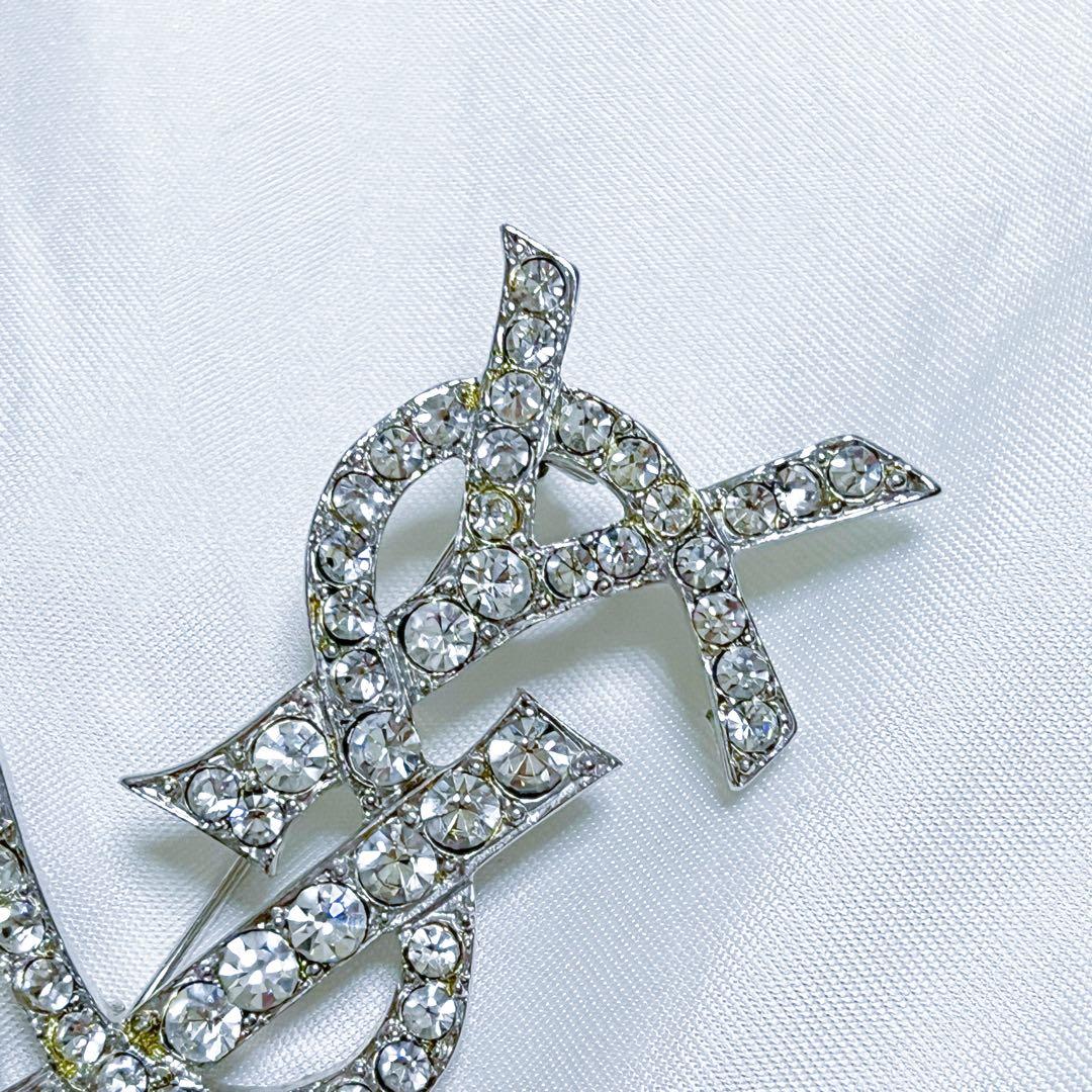 イヴサンローラン ブローチ カサンドラ YSLロゴ　ラインストーン シルバー