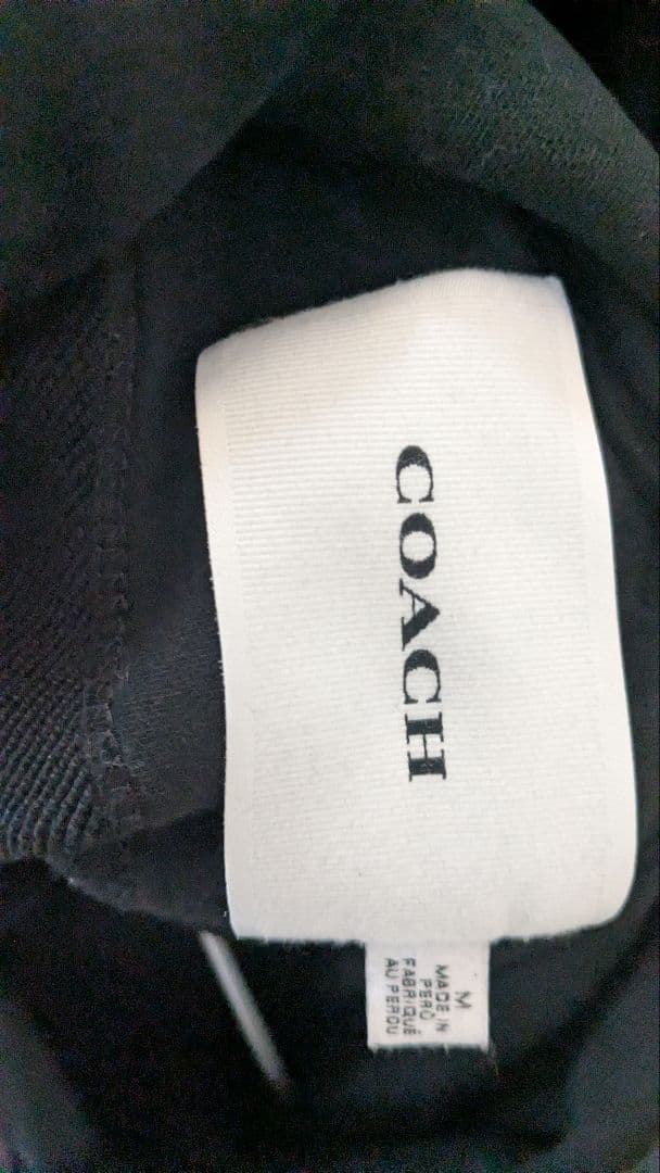 coachブラックリボンプリントパーカー