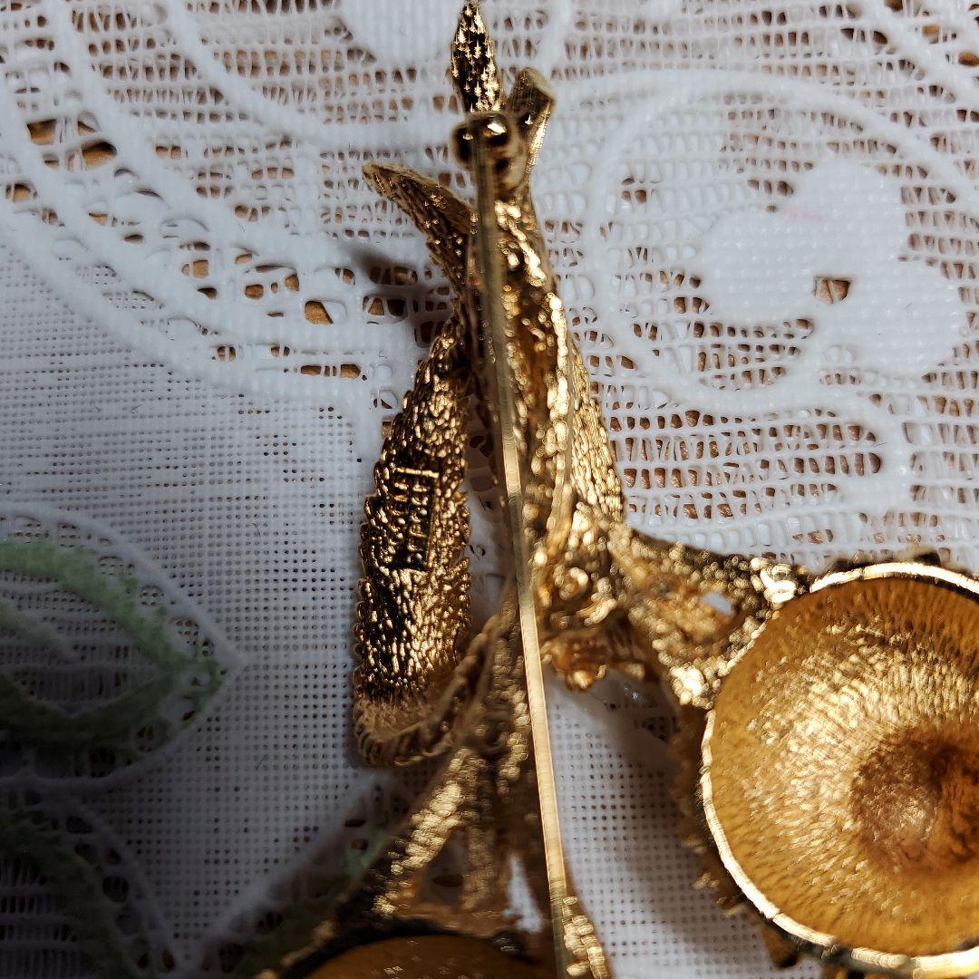 Carven 金色の花束ブローチ