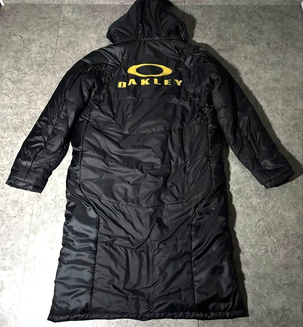 美品OAKLEY オークリー ベンチコート XL ロングコート フード付 ロゴ