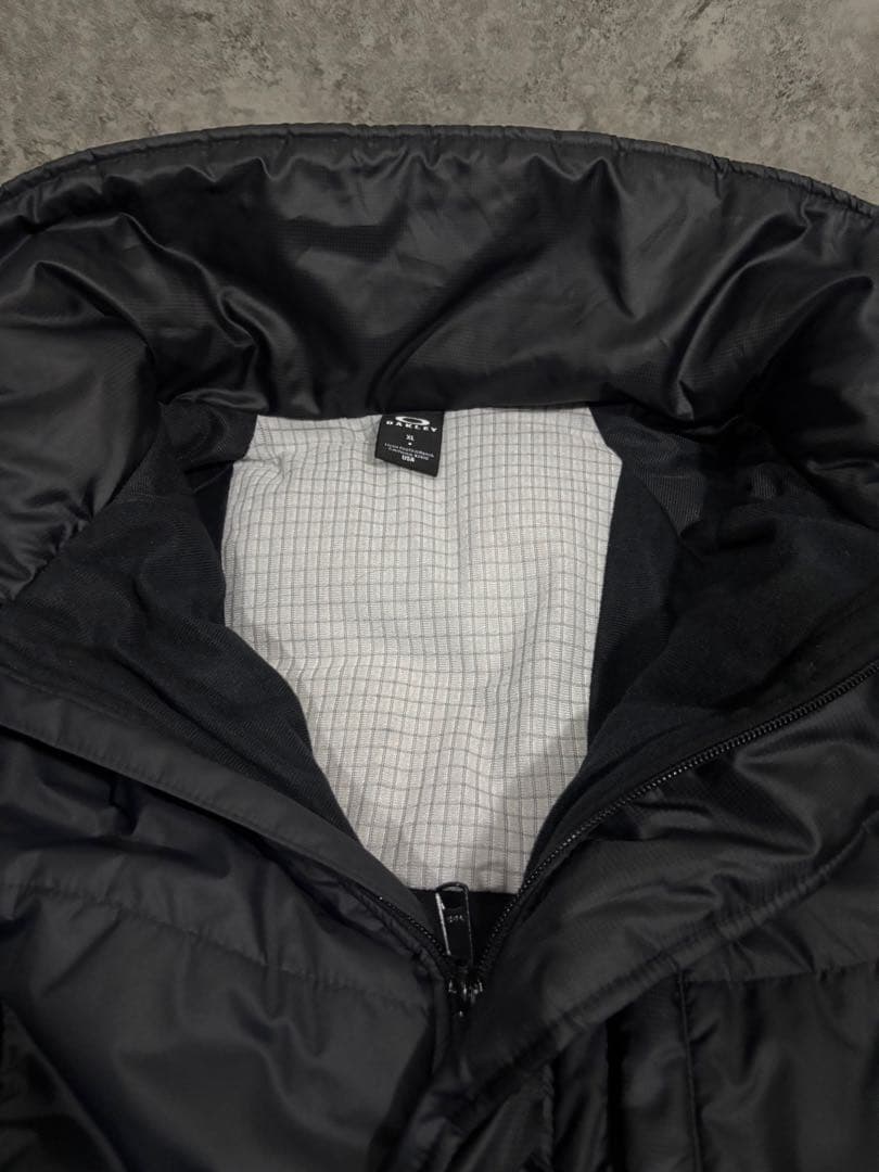 美品OAKLEY オークリー ベンチコート XL ロングコート フード付 ロゴ