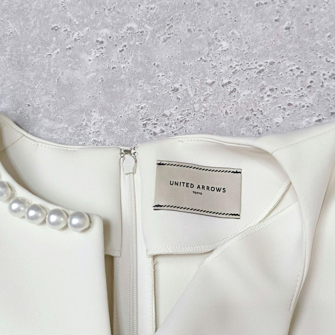 UNITED ARROWS SPONGY パールモチーフペプラムブラウス　38