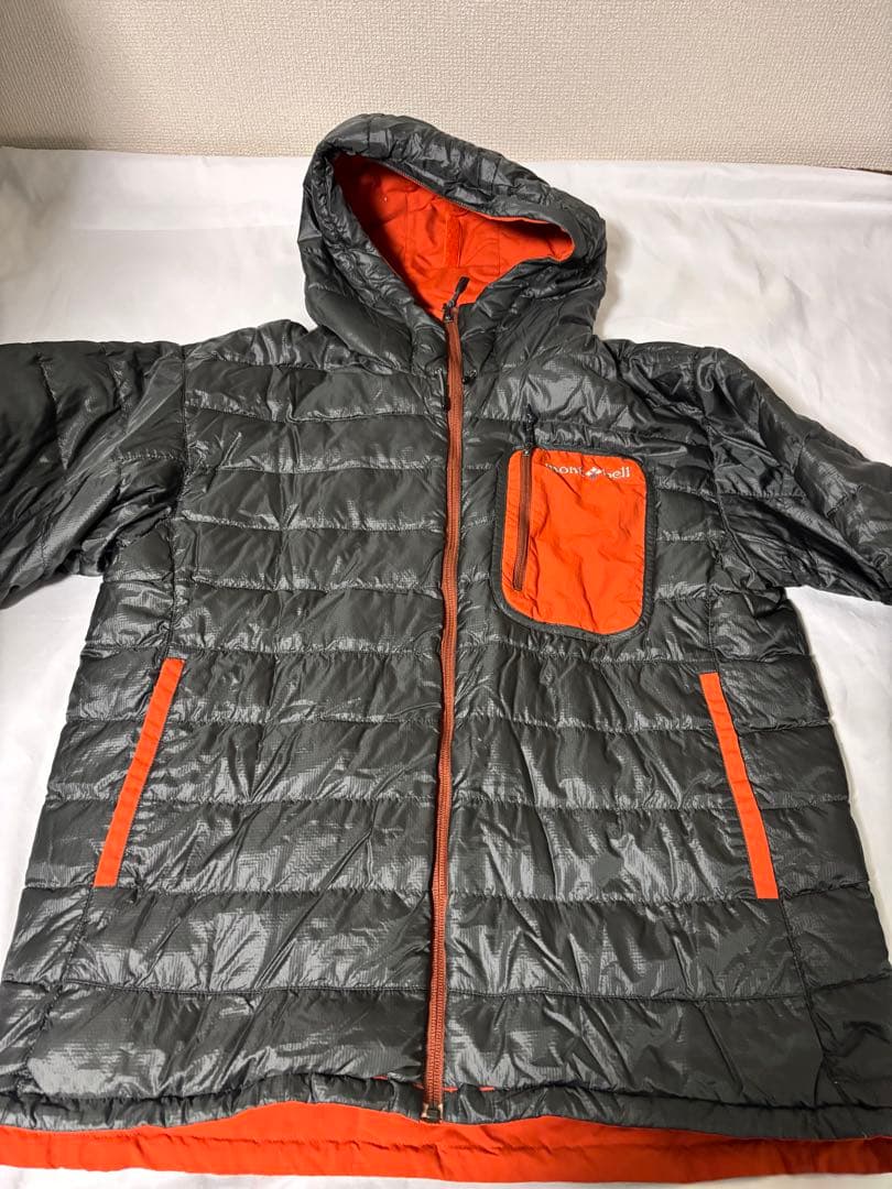 人気モンベル725FP コロラドパーカ　メンズLリバーシブルダウンオレンジグレー
