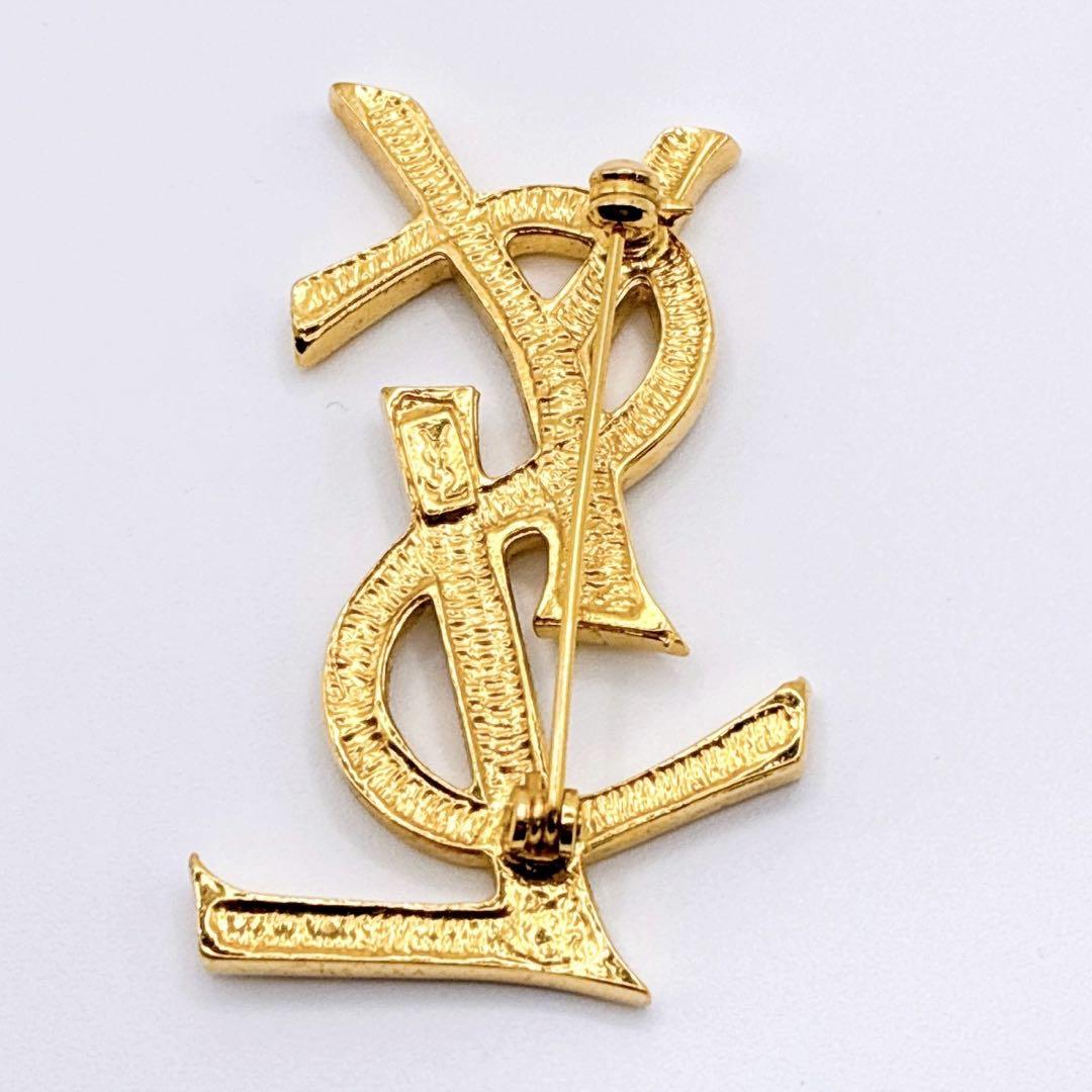 美品✨イヴサンローラン ブローチ カサンドラ ロゴ YSL ゴールド 人気