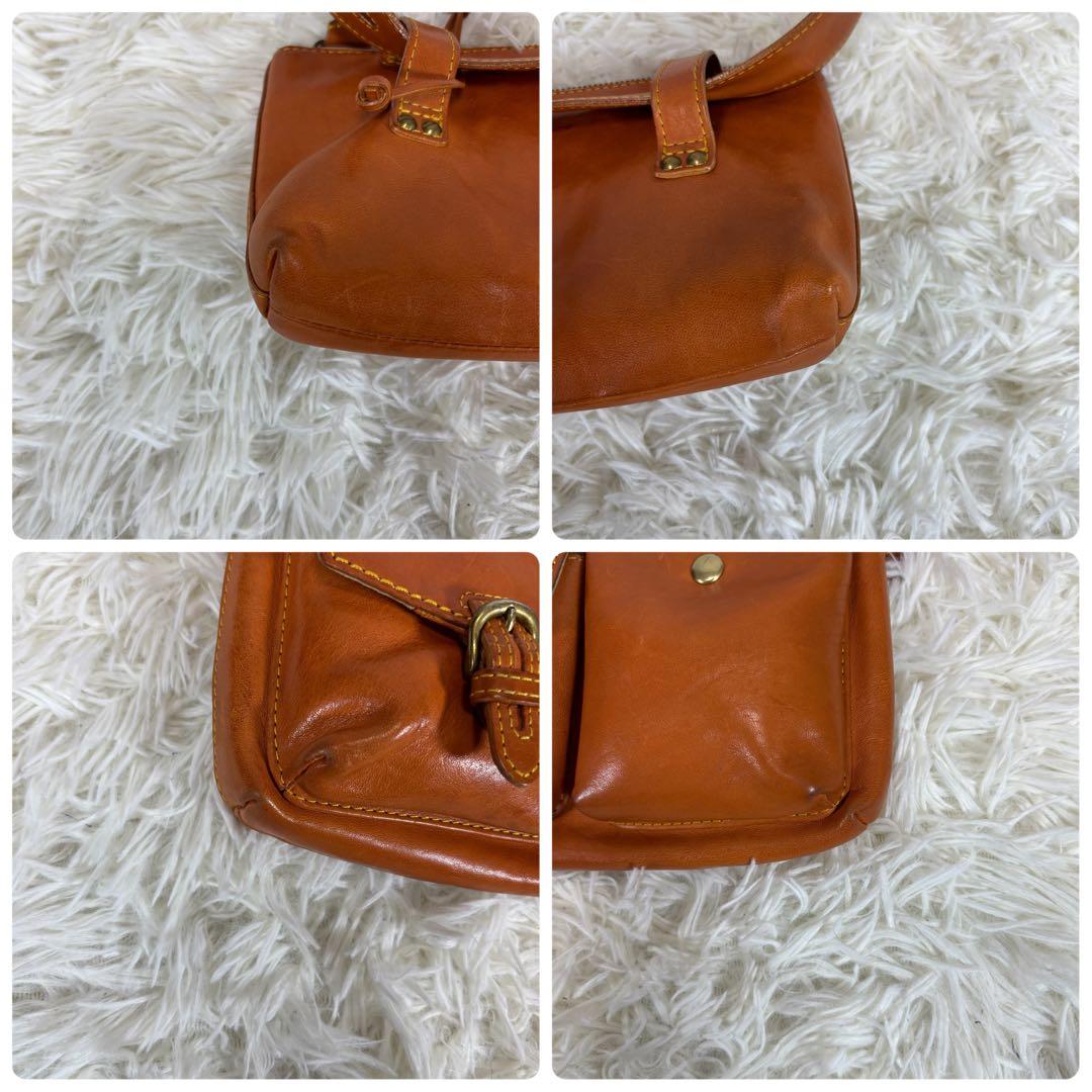 ダコタ ボディバッグ 斜め掛け 肩かけ ロゴ型押し ヌメ革 ベルト ユニセックス