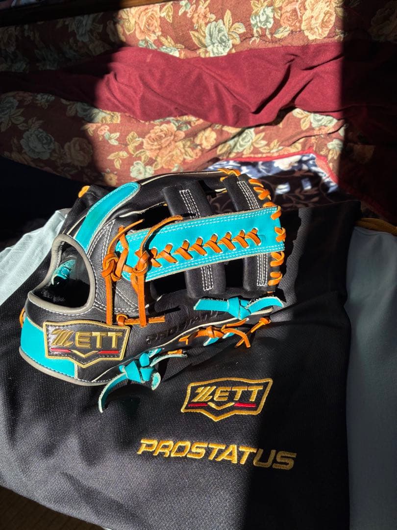 ZETT PROSTATUS 軟式グローブ 黒/青/オレンジ