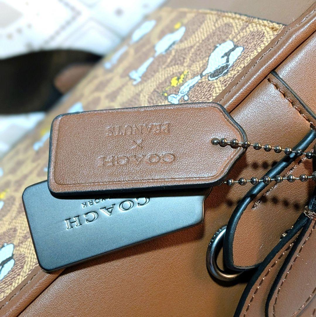 サリバン クロスボディ バッグ・シグネチャー キャンバス・スヌーピー プリント