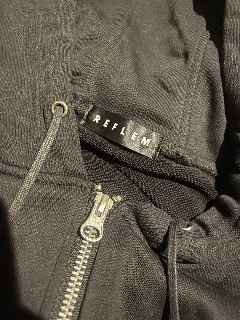 『REFLEM/レフレム』DリングロゴテープZIPパーカー