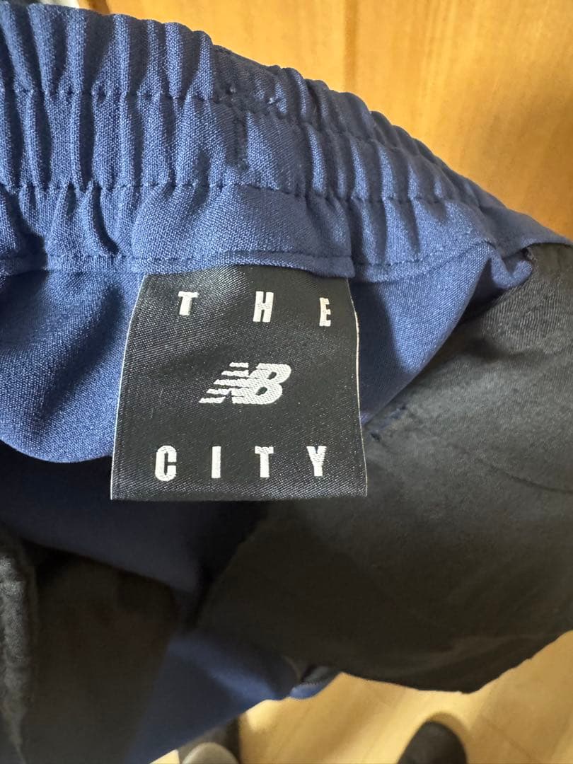 ニューバランス メンズ THE CITY ジャケット パンツ 上下セット ブルー