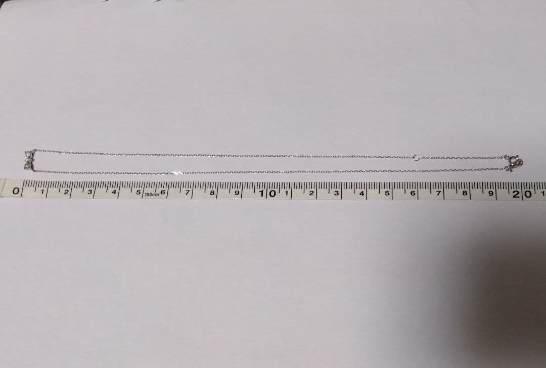 ジュエリーツツミ K10ホワイトゴールドリボン型ネックレス