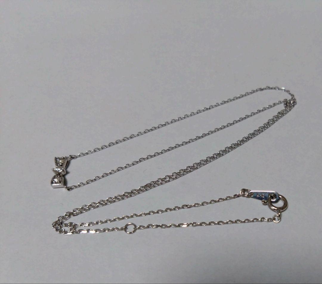 ジュエリーツツミ K10ホワイトゴールドリボン型ネックレス