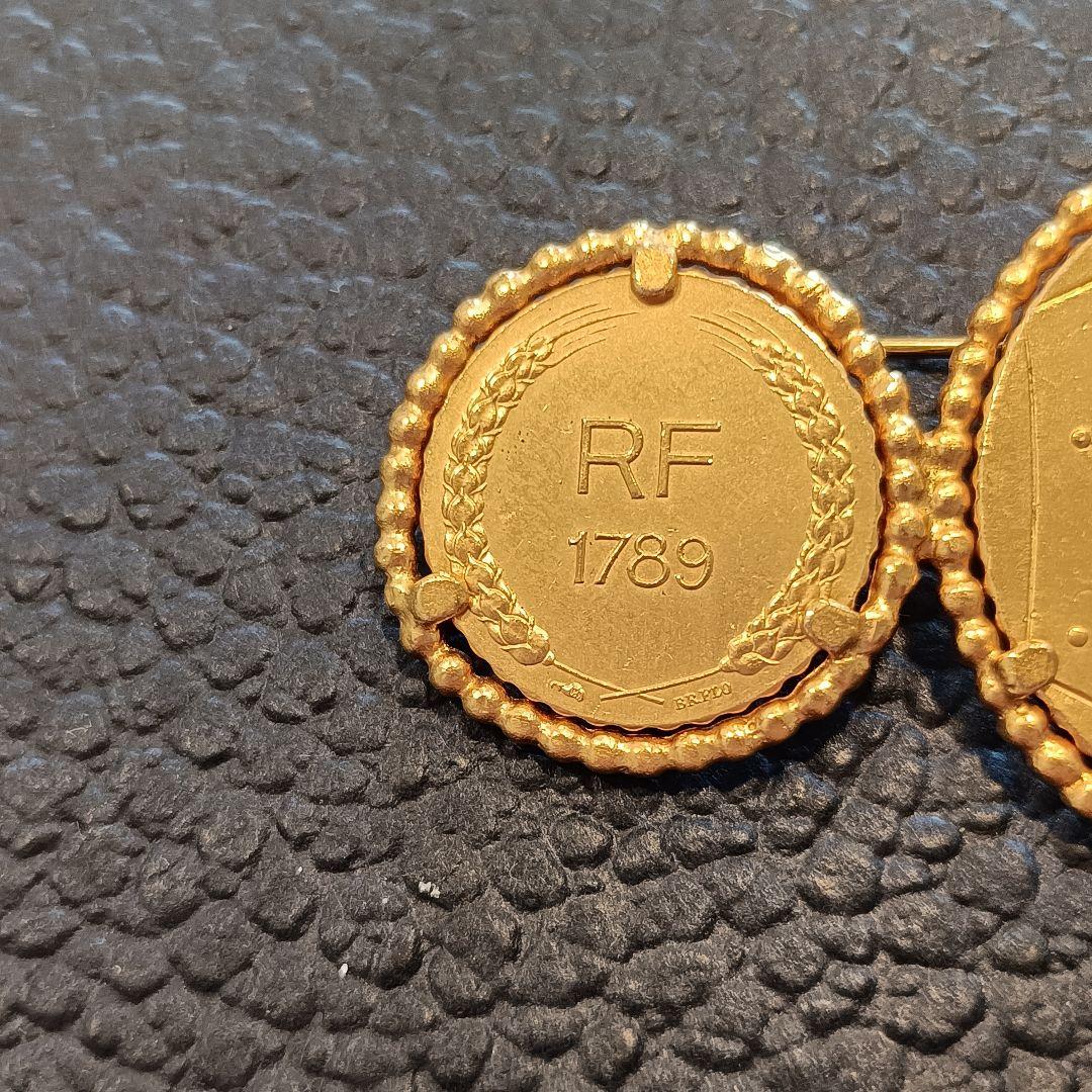 クリスチャンディオール　モチーフ　ブローチ　ゴールド