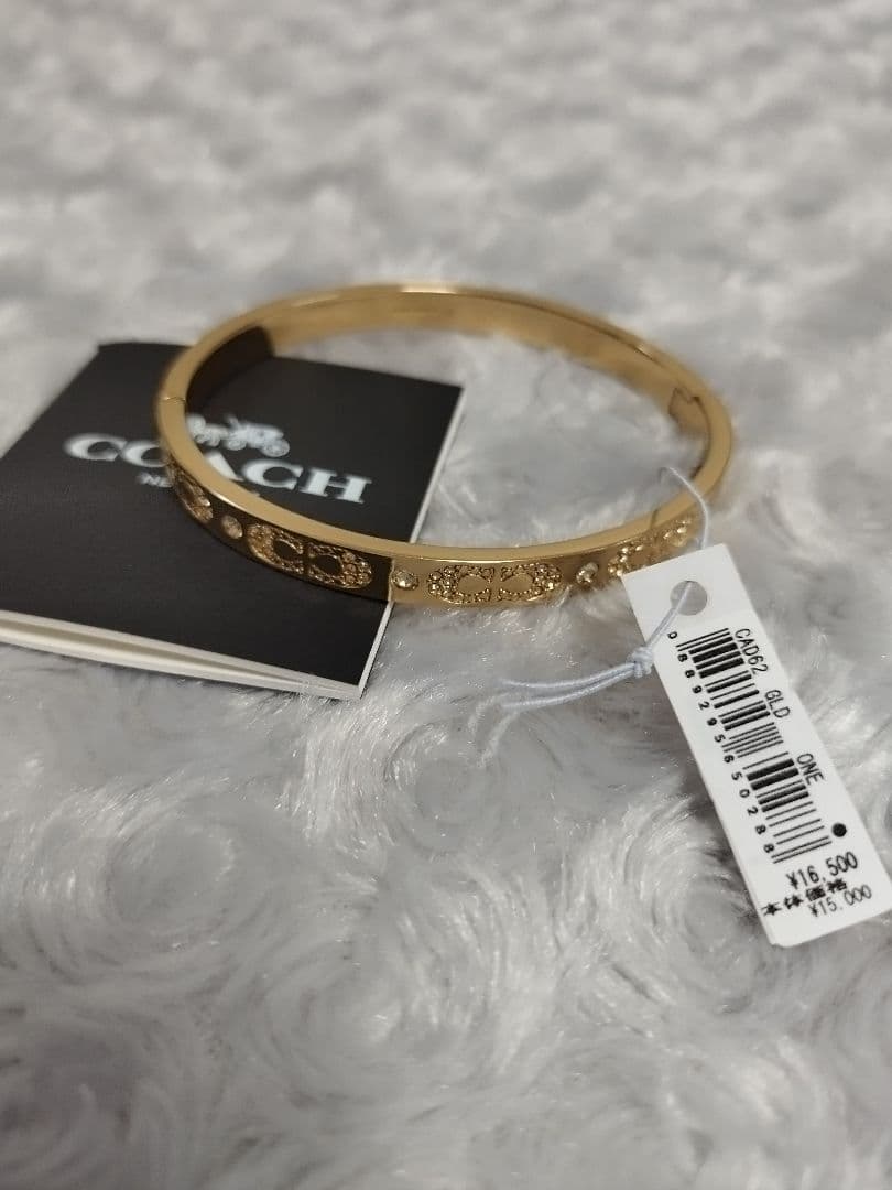 【新品】コーチ　シグネチャー パヴェ ヒンジド バングル CAD62 GLD