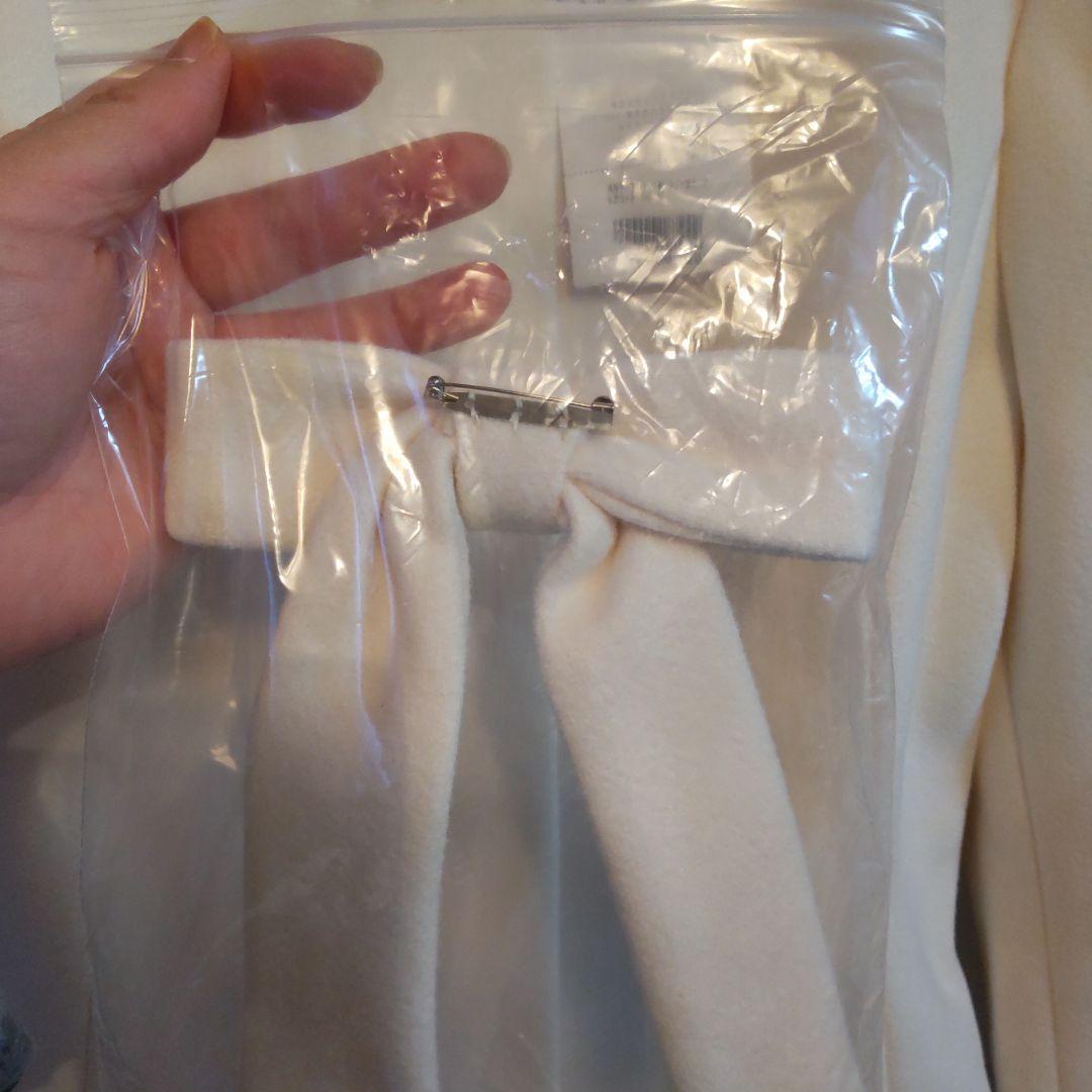 アンミールリボン付きノーカラーフレアコートホワイト