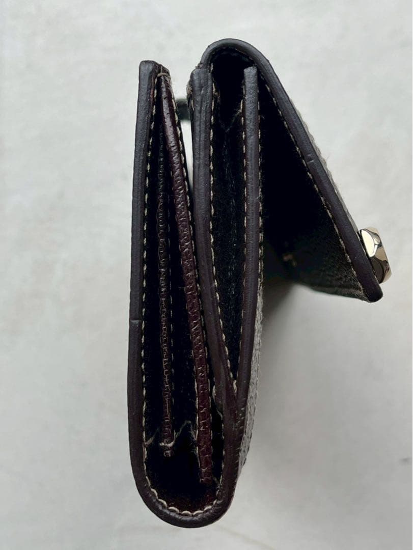 【新品未使用】グッチ 長財布 GGキャンバス ボルト スタッズ　定価56700円