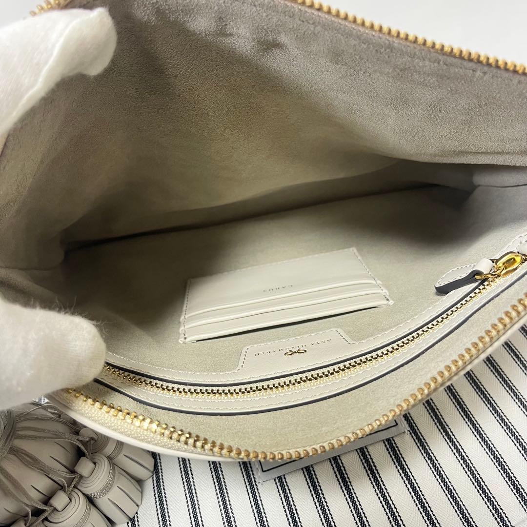 ANYA HINDMARCH ステッカーデザイン クラッチバッグ　フリンジ