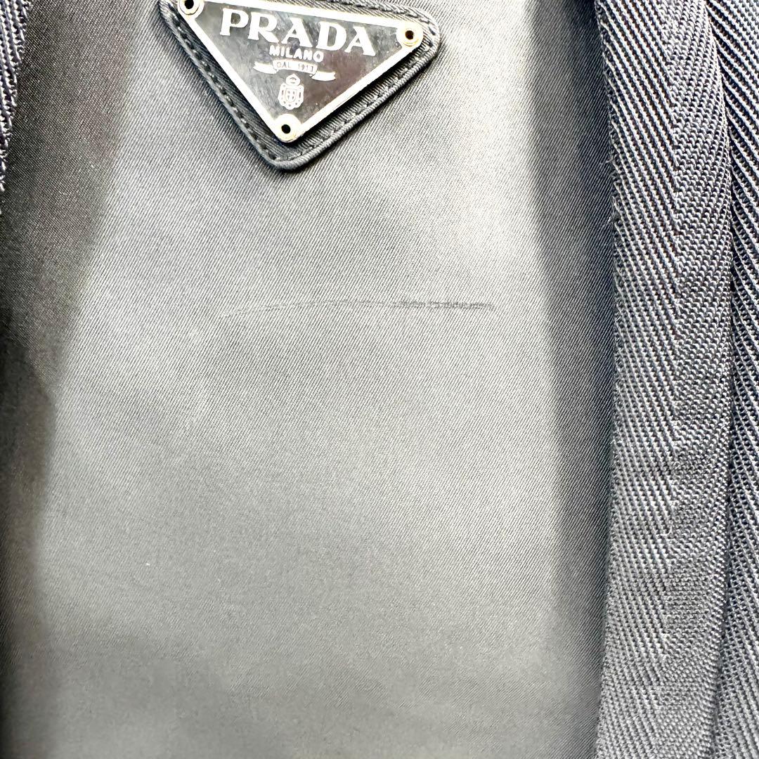 PRADA リュック ナイロン 三角 プレート 巾着 マルチポケット レザー