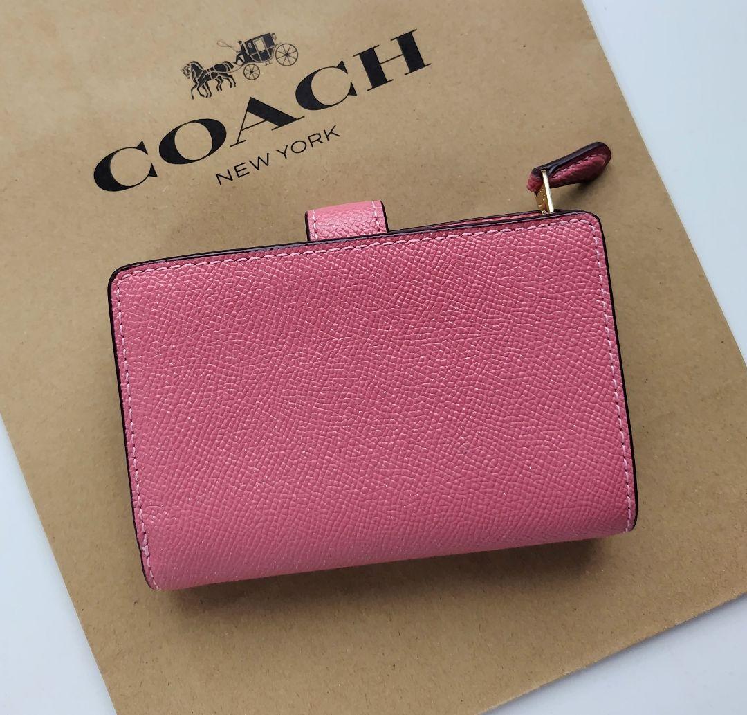 【新品】COACH コーチ 二つ折り財布 シグネチャー ピンク　レザー
