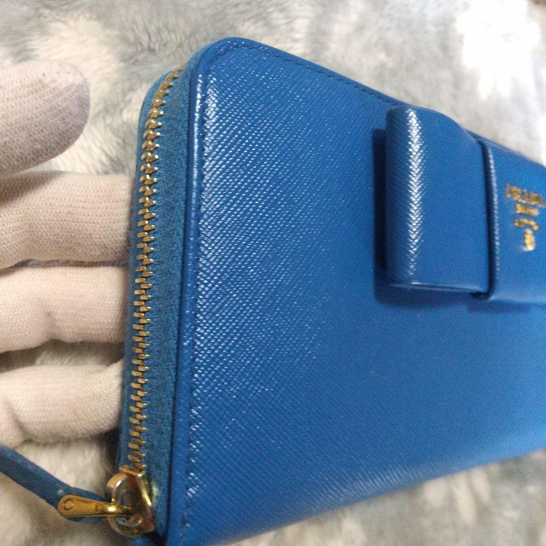 PRADAサフィアーノラウンドファスナー リボン付き長財布