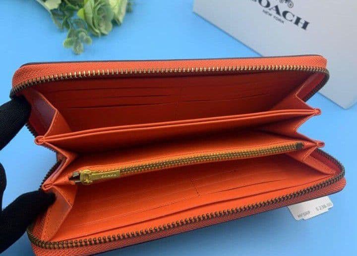 新品未使用コーチ長財布オレンジロングジップレディースメンズ送料無料即日発送