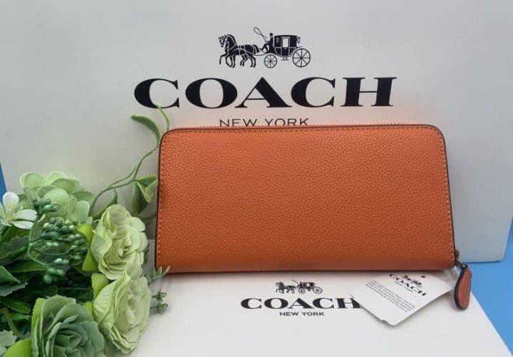 新品未使用コーチ長財布オレンジロングジップレディースメンズ送料無料即日発送