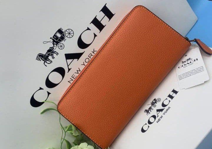 新品未使用コーチ長財布オレンジロングジップレディースメンズ送料無料即日発送