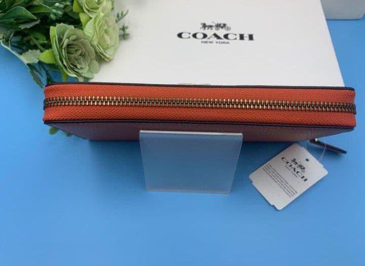 新品未使用コーチ長財布オレンジロングジップレディースメンズ送料無料即日発送