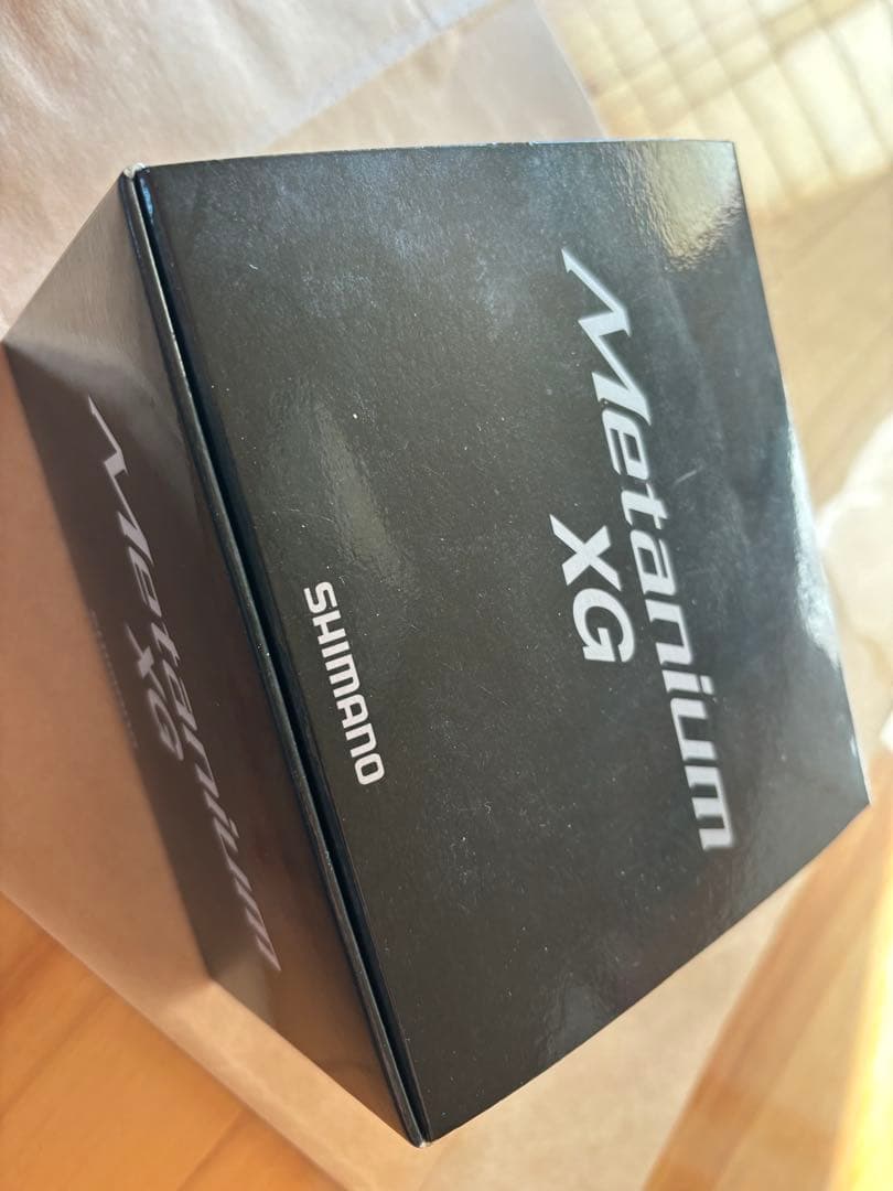 nium XG ベイトリール シルバー/ブラック