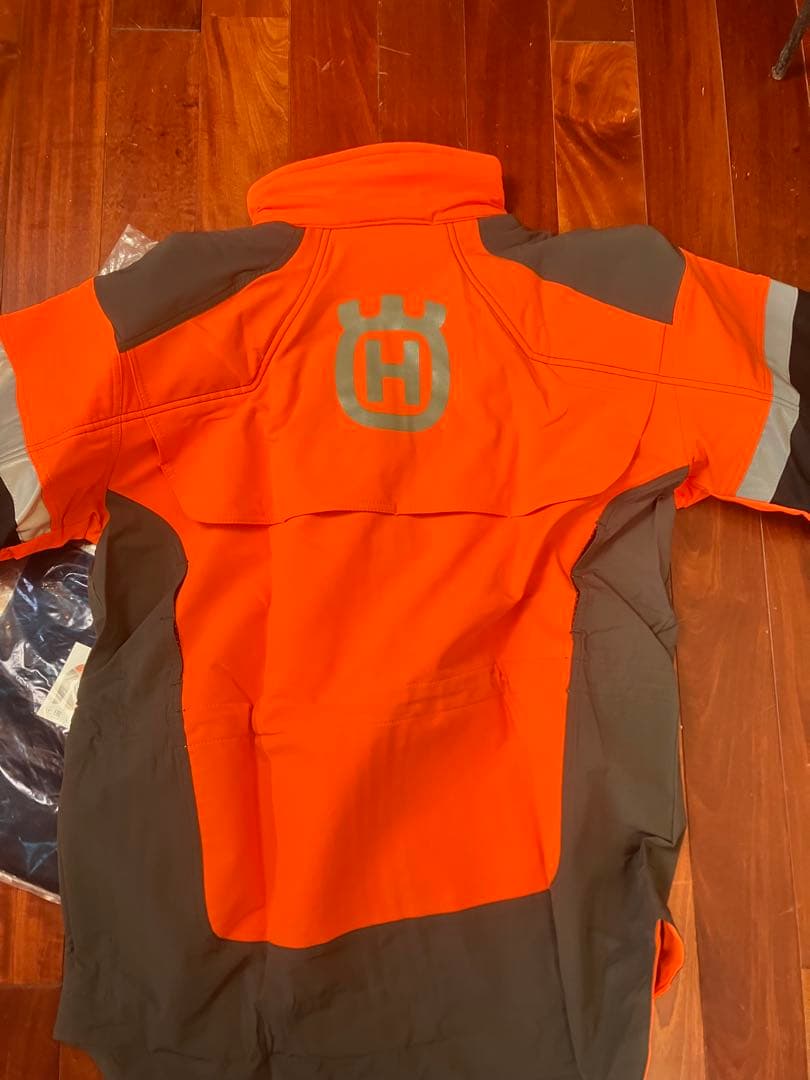 新品　Husqvarna テクニカルジャケットLサイズ オレンジ　おまけ付き
